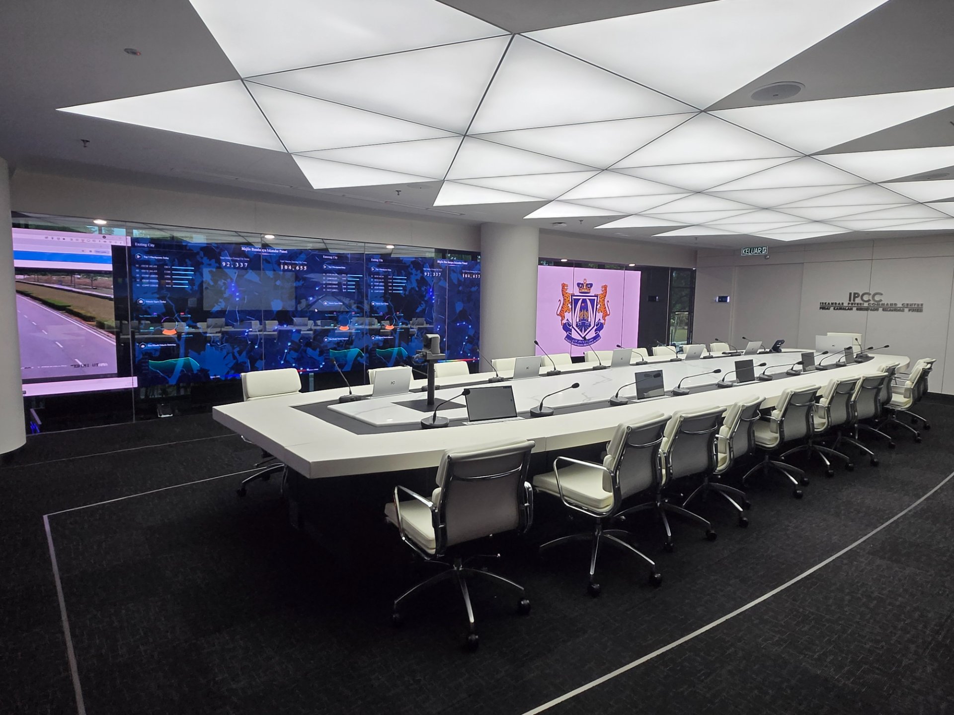IPCC command room — executive boardroom with city dashboard video wall